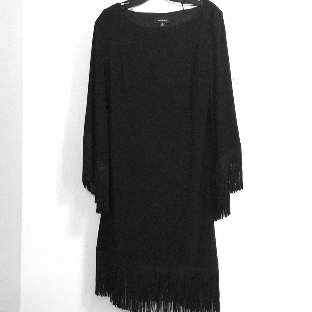 Black dress with fringe hem and sleeves
